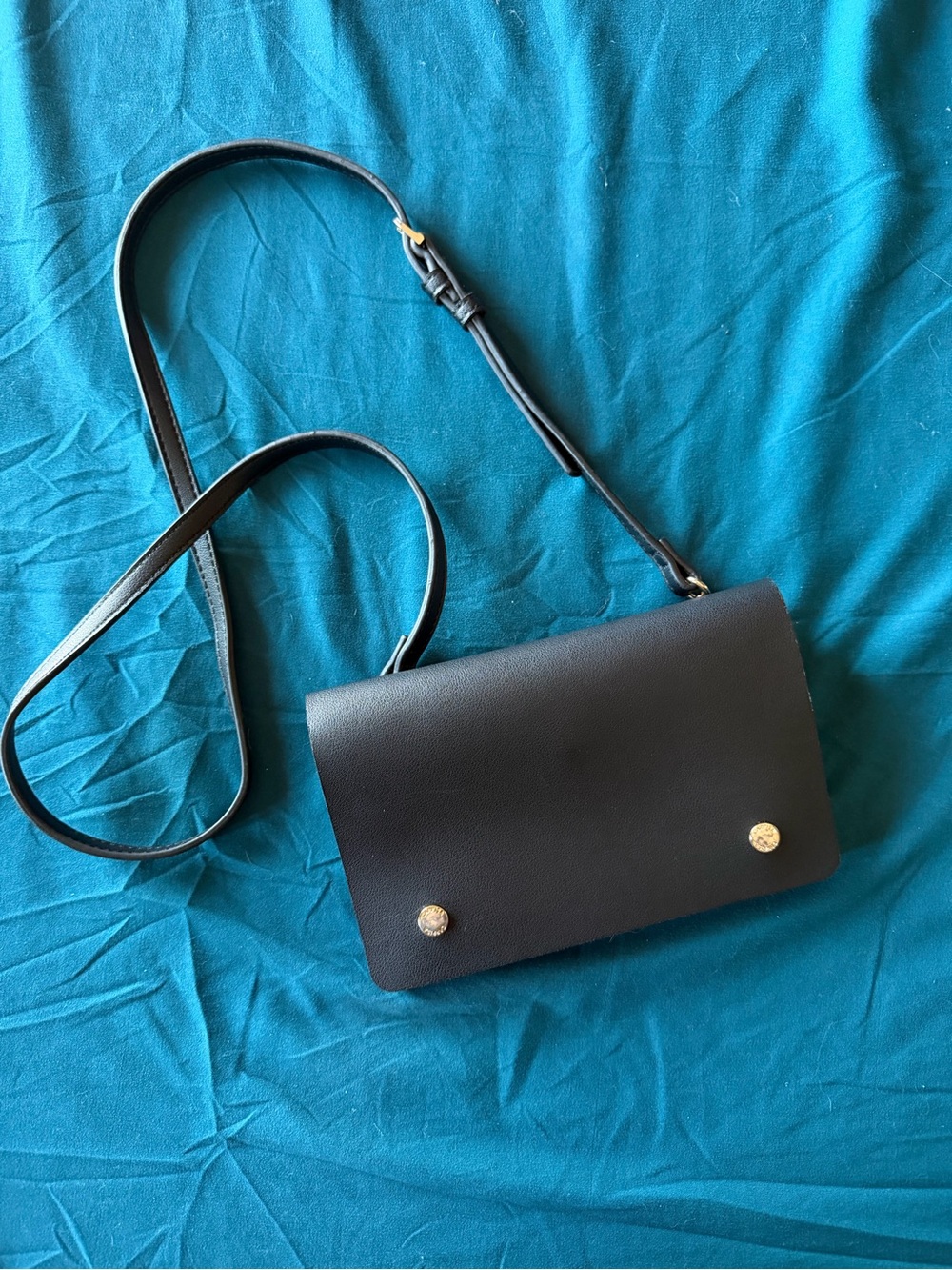 Sleek Black Leather Crossbody with Gold Button Accents